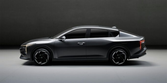 "A sleek modern car on a scenic road, showcasing electric vehicle technology, futuristic design, and automotive innovation in high resolution"